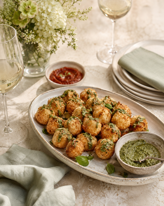 Crispy Herbed Mozzarella Bites with Pesto Drizzle